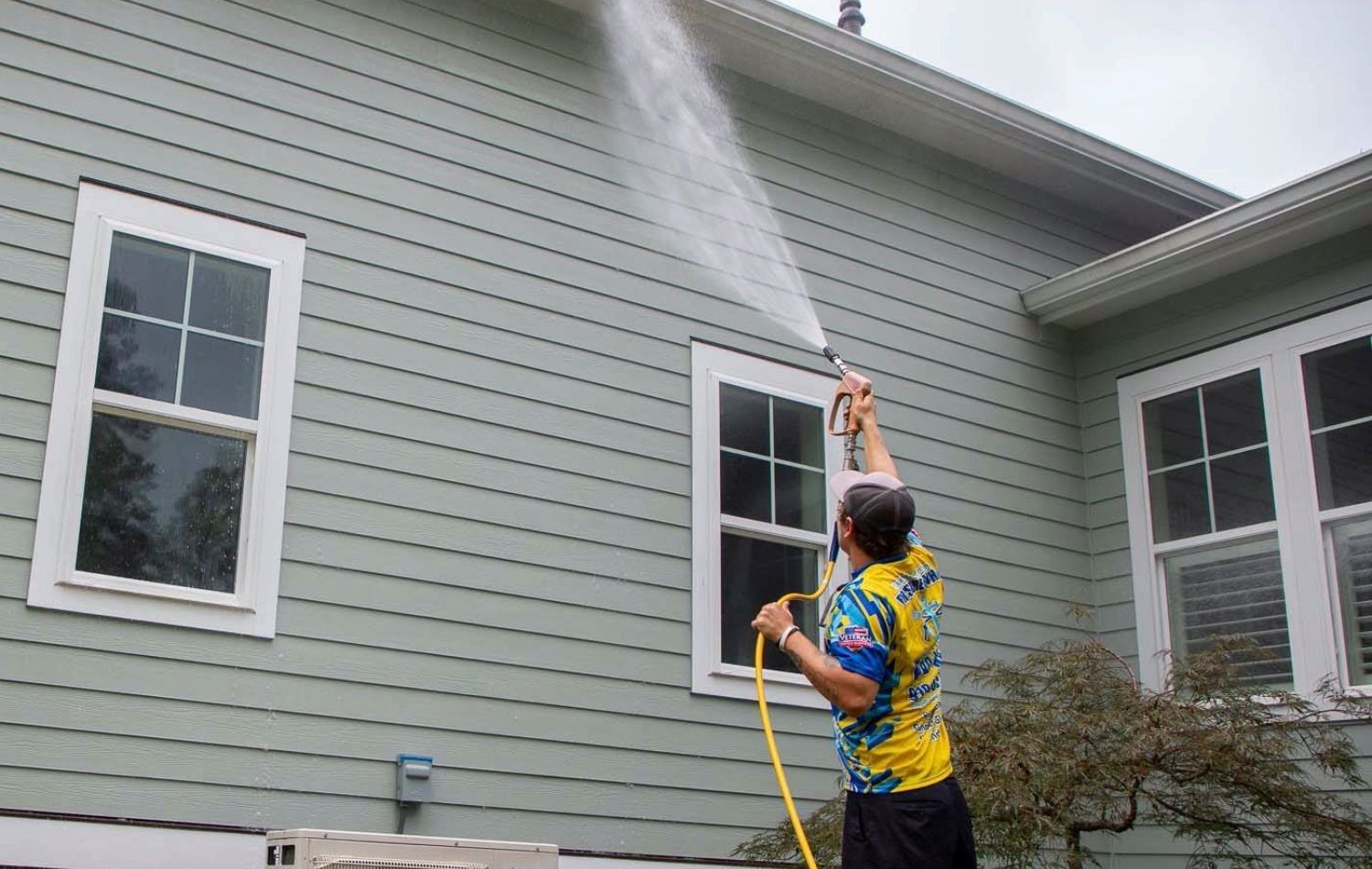 Before and after house siding power washing transformation